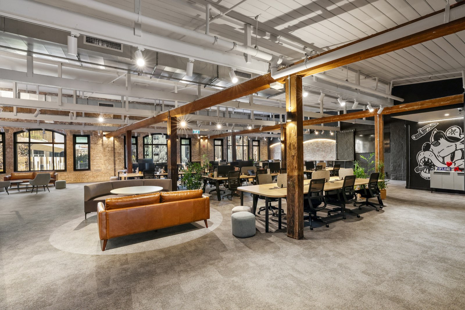 Open-plan warehouse office fitout for Ofload with exposed timber beams and full electrical and data services