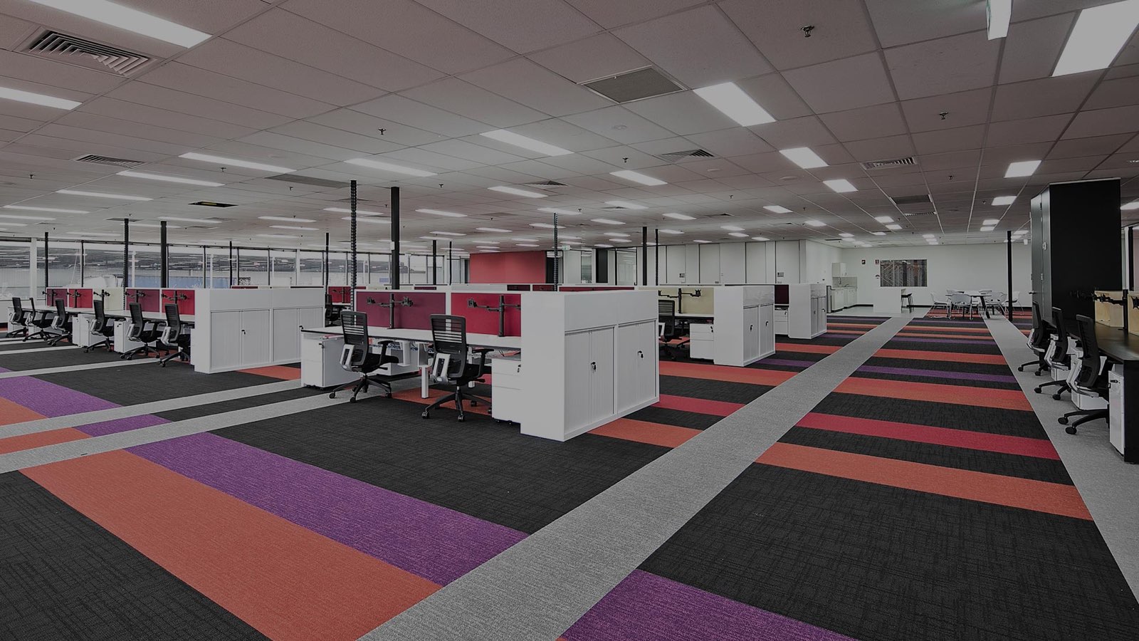 Large open-plan office floor at AMR Ingleburn with workstation power and data by North Side Cabling