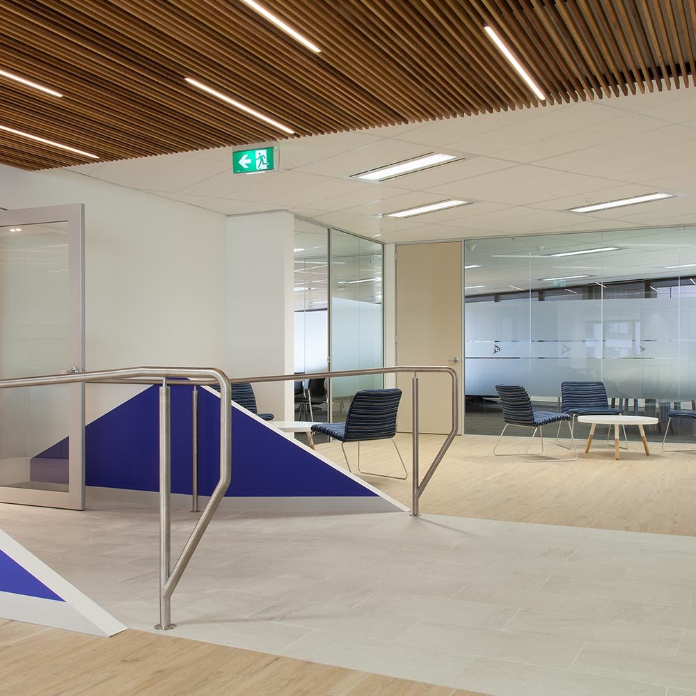 Timber slat ceiling with integrated linear lighting at the Injury Treatment fitout